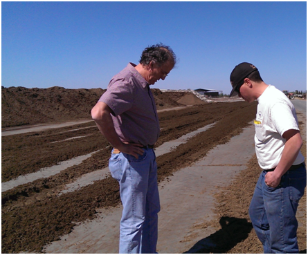Alejandro Castillo (Dairy Farm Advisor) (left) discussing on fresh manure piles with a dairy farmer in Merced County (photo credit: Pramod Pandey)